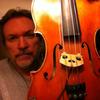 Mark O'Connor holds his damaged violin