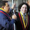 Venezuelan President Hugo Chavez (L) speaks next to Gustavo Dudamel (R) in Caracas on Feb. 12, 2011