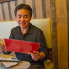 Concertmaster Frank Huang considers the menu at La Salle Dumpling Room