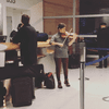 Violinist Michelle Ross plays while her flight is delayed at JFK.