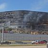 Smoke billows from a building that houses IRS offices after a small plane crashed into it February 18, 2010 in Austin, Texas.