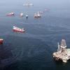 JULY 18: Oil sheen is seen with vessels assisting near the source of the BP Deepwater Horizon oil spill on July 18, 2010 in the Gulf of Mexico off the coast of Louisiana. 