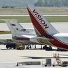 A Vision airlines plane presumed to be carrying 10 men and women who worked as Russian spies in the United States sits on the tarmac at Vienna airport where it parked next to a Russian jetplane on Jul