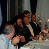 Impresario Tibor Rudas sits to the left of Luciano Pavarotti in 2000