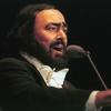 Italian tenor Luciano Pavarotti performs during a concert in Bucharest Aug. 11, 1999. The concert took place on the day of the last total solar eclipse of the millennium. 