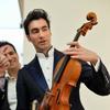 David Aaron Carpenter, the violist, holds the Macdonald viola by Antonio Stradivari, made in 1719, at Sotheby's.