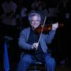 Itzhak Perlman plays the National Athem before a Brooklyn Nets and the Orlando Magic game at the Barclays Center on January 28, 2013