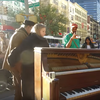 Kevin Shoemaker plays a piano in Union Square