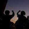 People raise their fists Tuesday, June 23, 2020, in Kansas City, Mo., during a protest over the death of Black people at the hands of police. 
