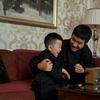 Father and son listening to radio
